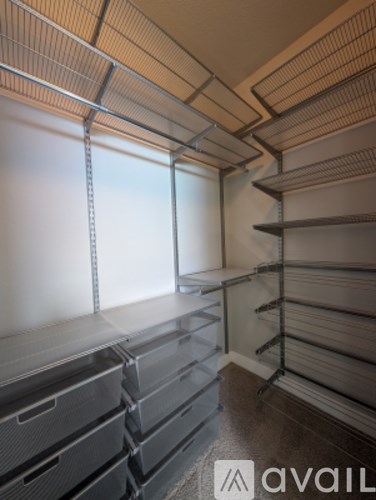 A storage room with shelves and drawers.