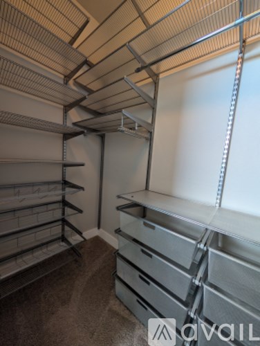 A storage room with metal shelving and drawers.