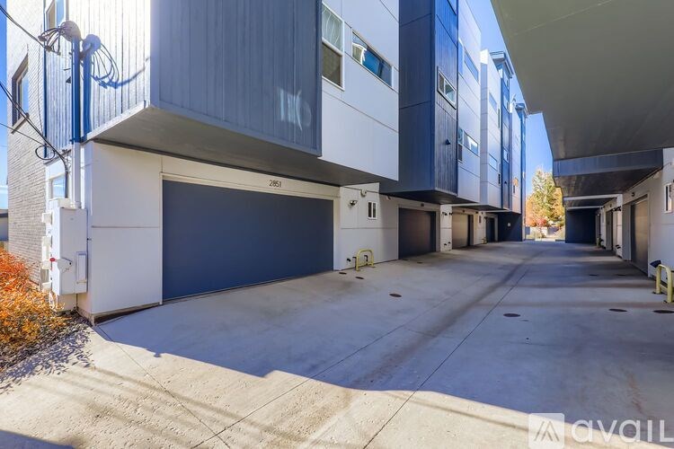 A parking garage with a concrete floor and multiple levels.