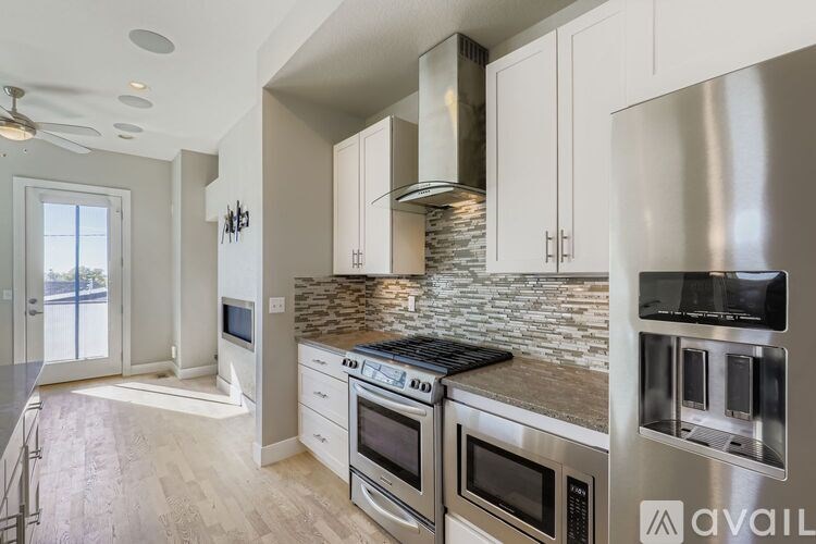 A person is standing in front of a bathroom sink.
