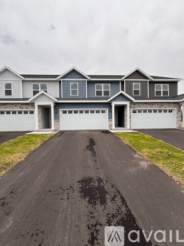 A house with a driveway in front of it.