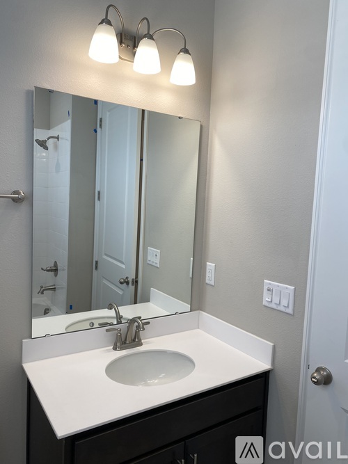 A bathroom sink with a mirror above it.