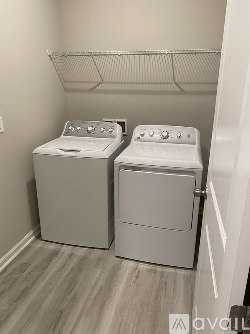 A laundry room with a washer and dryer.