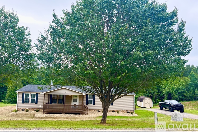 A house with a brown roof and a porch.
