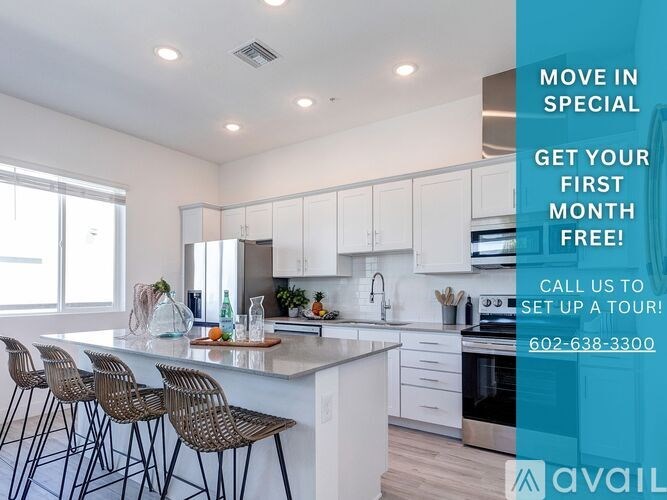 A kitchen with a counter and chairs and a sign offering a free first month.
