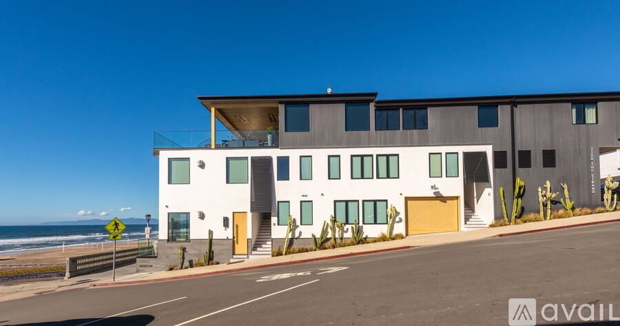 A modern building with a clear blue sky in the background.
