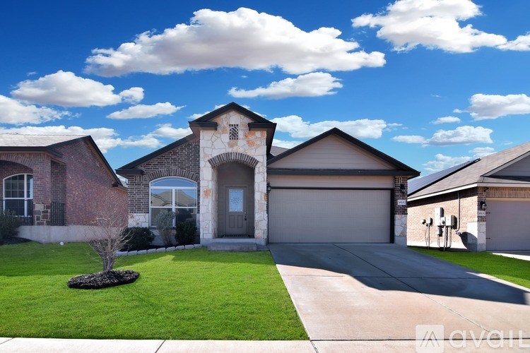 A house with a brick facade and a large front yard.