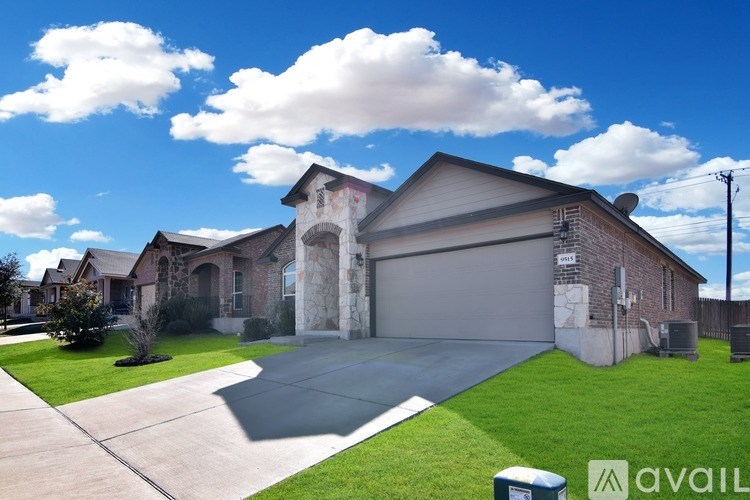 A house with a driveway in front of it.