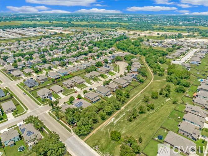 A suburban neighborhood with houses and streets.