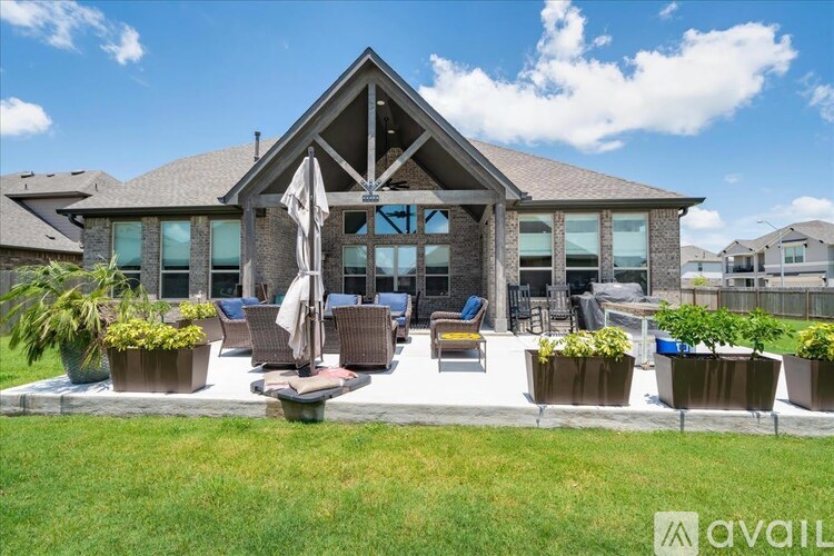 A house with a patio and a pool table.