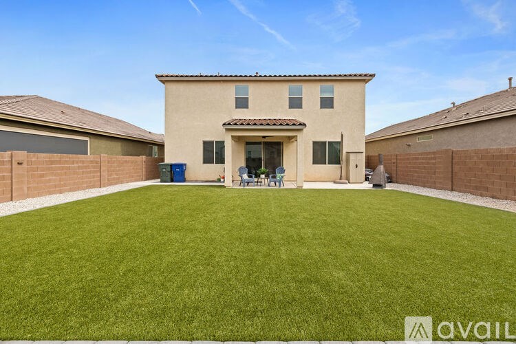 A house with a lawn in front of it.