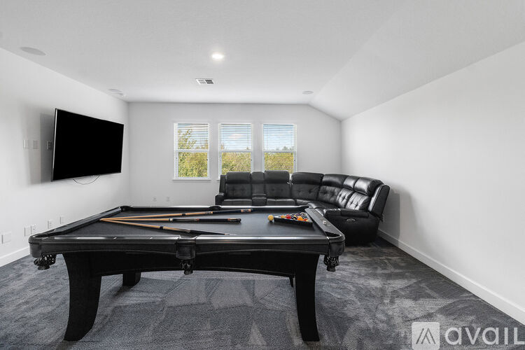 A modern dining room with a table set for four.