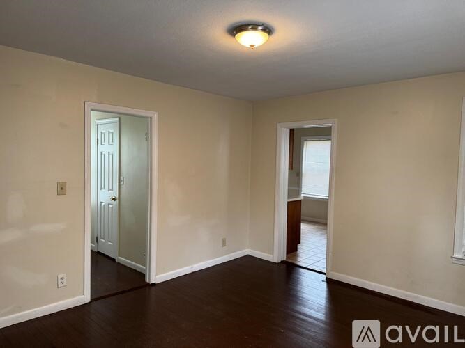 A room with a door and a window.