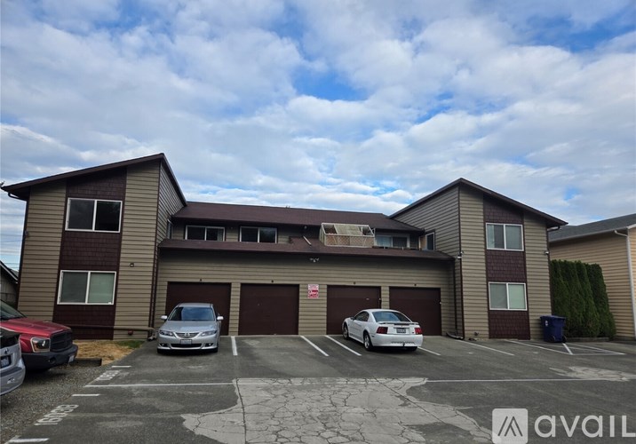 A building with a parking lot in front of it.