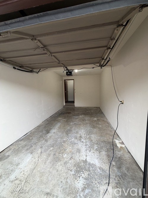 A brown door with shelves inside is open.