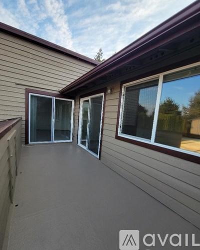 A house with a balcony and a window.