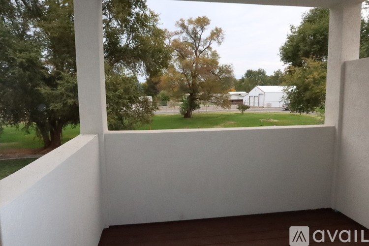 A long hallway with a carpeted floor and white walls.