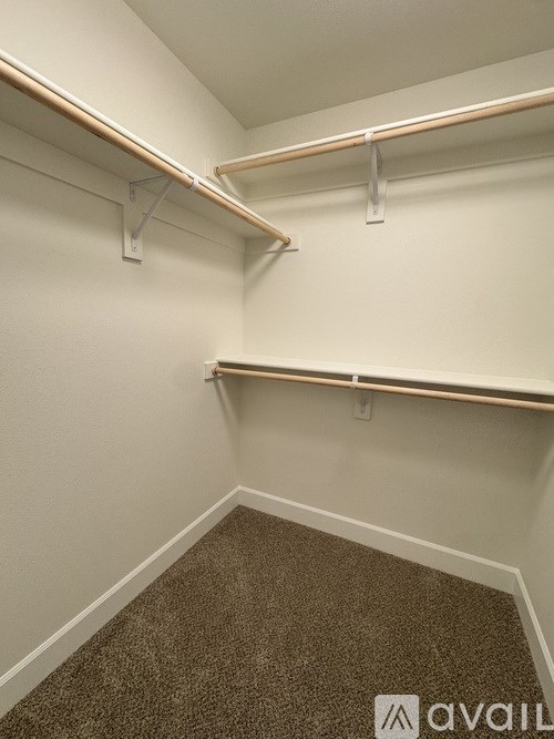 A bathroom with a sink, mirror and lights.