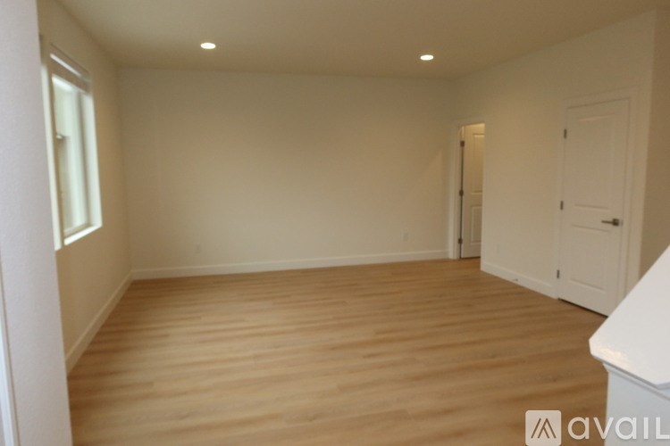 A concrete structure with a gravel pathway leading to a garage.