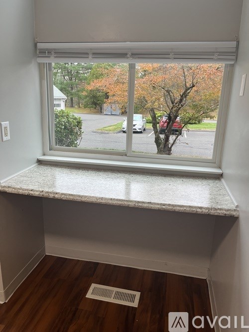 A bathroom with a floral wallpaper and a sink.