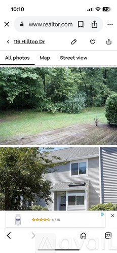 A bedroom with a bed, nightstand, and lamp.