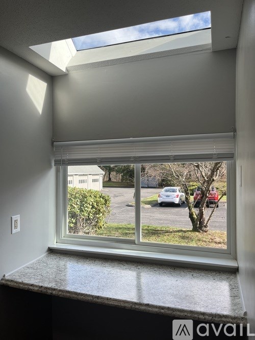 A white garage door with a window in the middle.