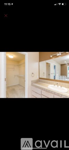 A bathroom with a sink and mirror.