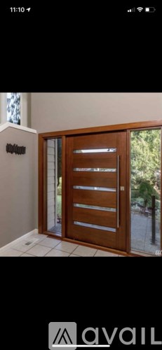 A wooden door with glass panels is closed.