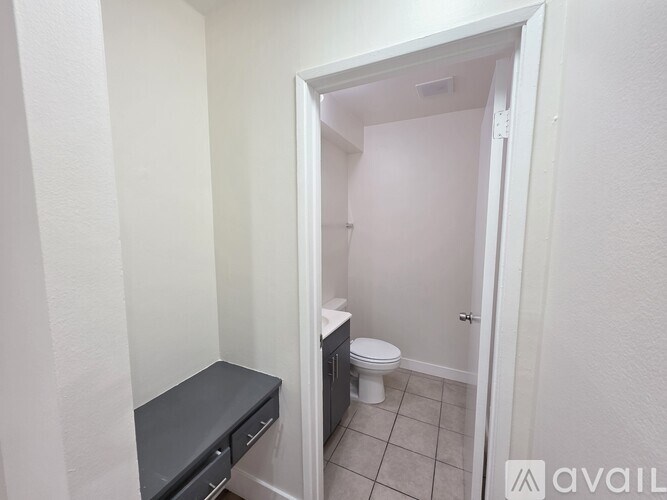 A bathroom with a toilet and a sink.