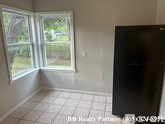 A room with a BB Realty Partners sign on the wall.