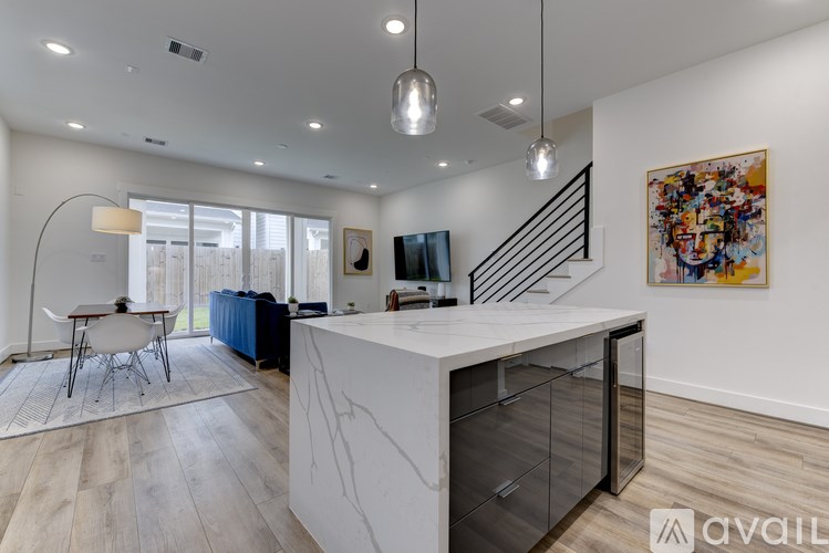 A modern kitchen with a white countertop and a large island.
