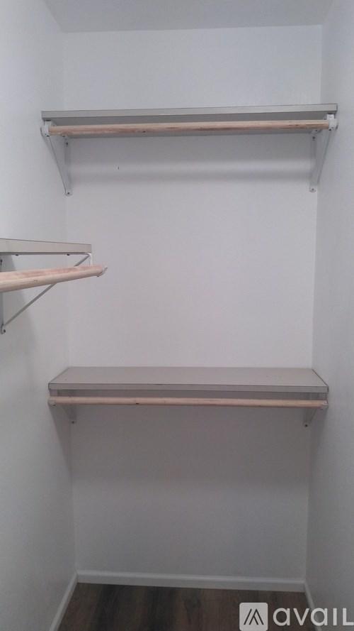 Empty shelves in a white room.
