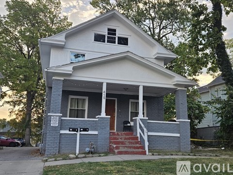 A kitchen with brown cabinets and a white stove top oven.