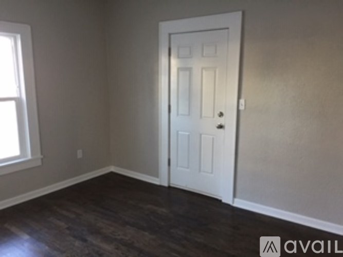 A room with a door and a window.