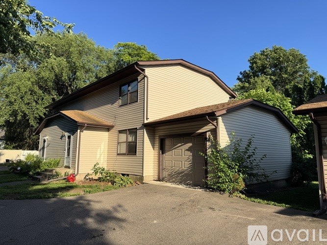 A house with a garage is for sale.