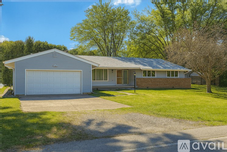 A house with a garage is for sale.