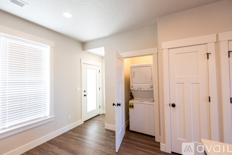 A small laundry room with a washer and dryer.