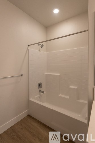 A white bathroom with a walk-in shower.