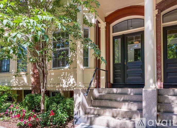 A house with a front porch and steps leading up to it.