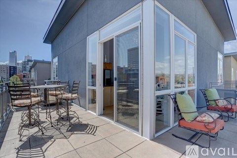A patio with a table and chairs is shown.