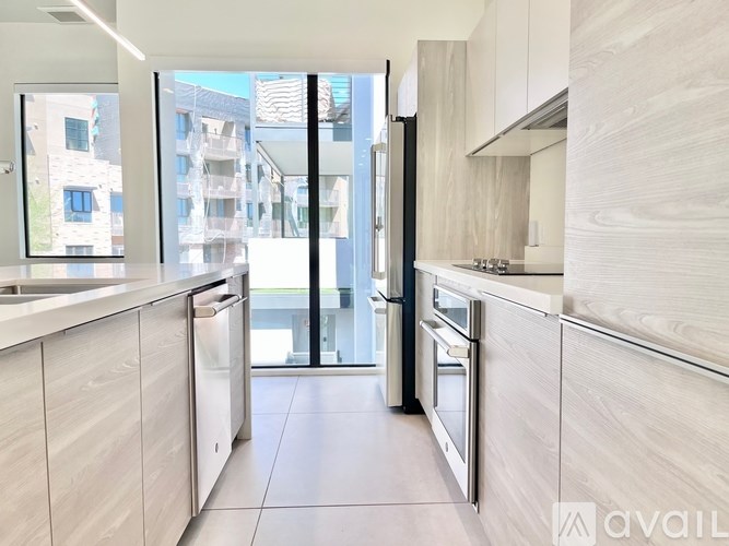 A modern kitchen with a view of the city.