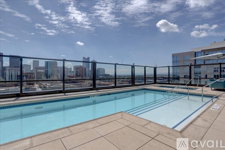 A pool with a view of the city skyline.
