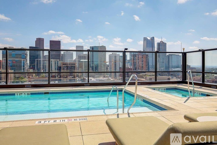 A pool with a city skyline in the background.