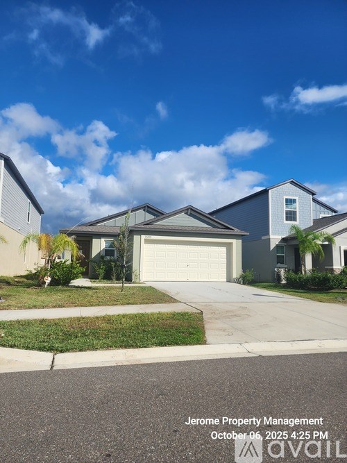 A residential area with houses and a clear sky.