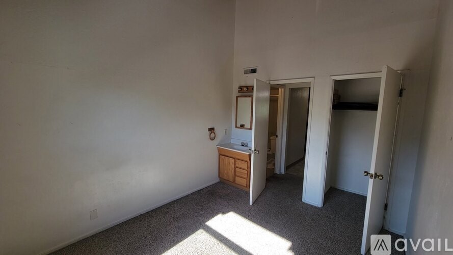 A room with a bed and a dresser in it.