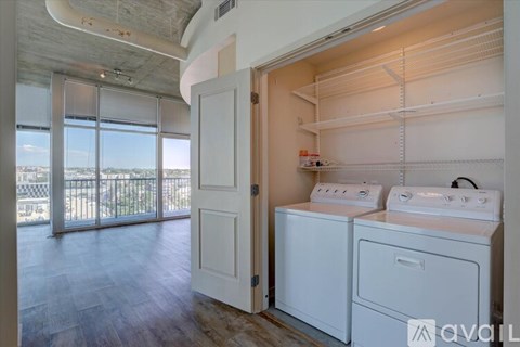 A laundry room with a washer and dryer in it.