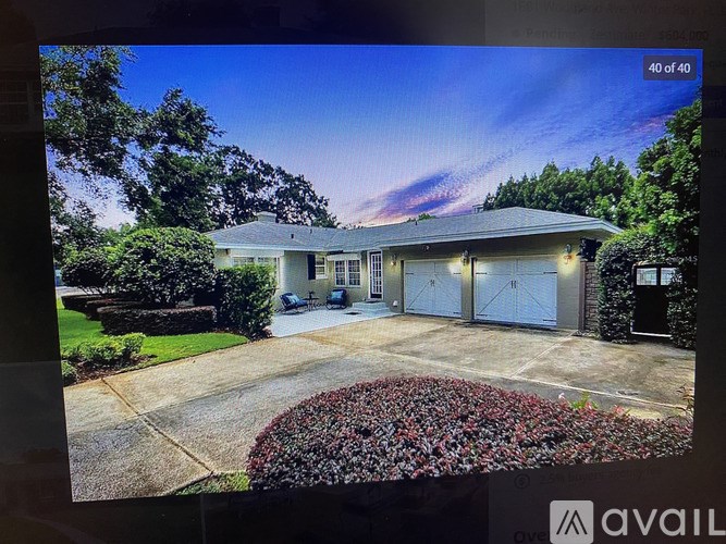 A house with a driveway and garage is on the market.