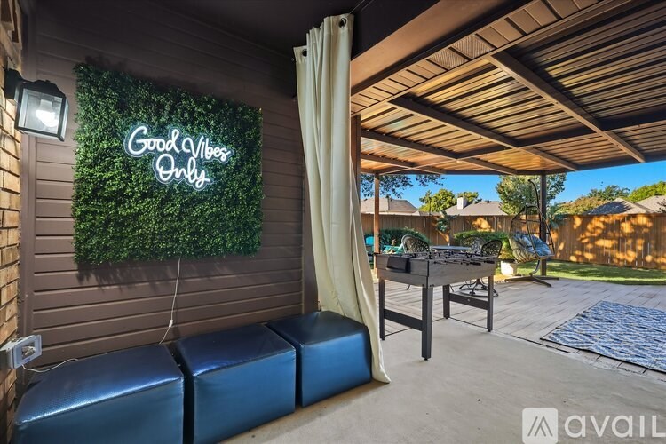 A sign that says "Good Vibes Only" is displayed on a wall.