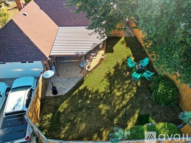 A backyard with a lawn and a shed.