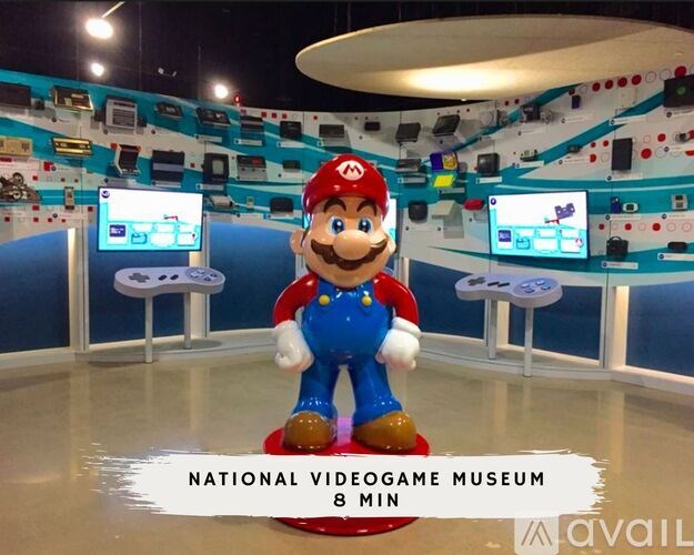 A video game museum with a Mario statue in the foreground.